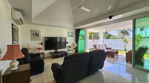 The sofa- and TV area and the outdoor lounge-area
