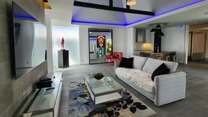 The sofa-area with the 75 Inch Smart-TV