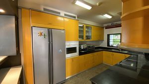 The spacious kitchen is in a half-open room