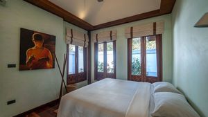 The spiritual touch of a Teak-house bedroom