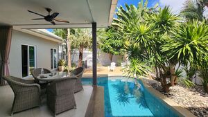 The terrace besides the curved pool