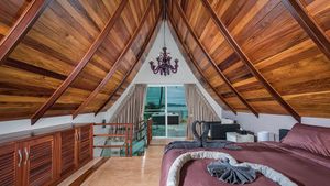 The upstairs bedroom with views across the sea