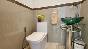 There are 2 bathrooms and this guest toilet
