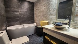This decent bathroom has a modern tub