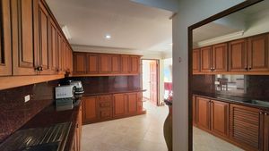 This is a very large and well equipped kitchen for a condominium flat