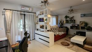 This living-room also provides a home-office