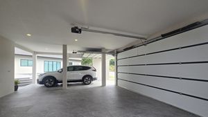 Two automatic roller garage doors for 3 cars