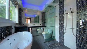 Two of the bathrooms offer double-shower and Jacuzzi tub