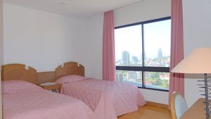 A bedroom with views across the Buddha hills