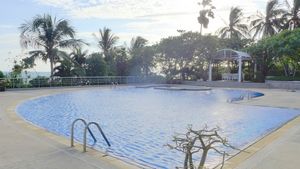 The condos pool with direct access to the sandy beach